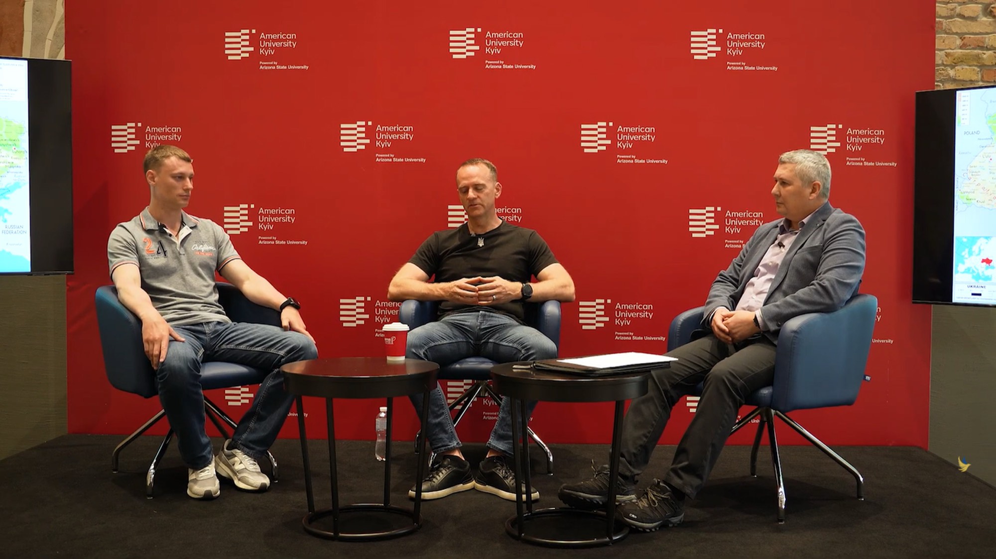 Samuel Cook speaking at a panel in Kyiv